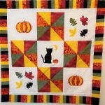Made with 5 different color batik fat quarters in vibrant tones and multi-color pinwheels and 2 fat quarters of background fabric